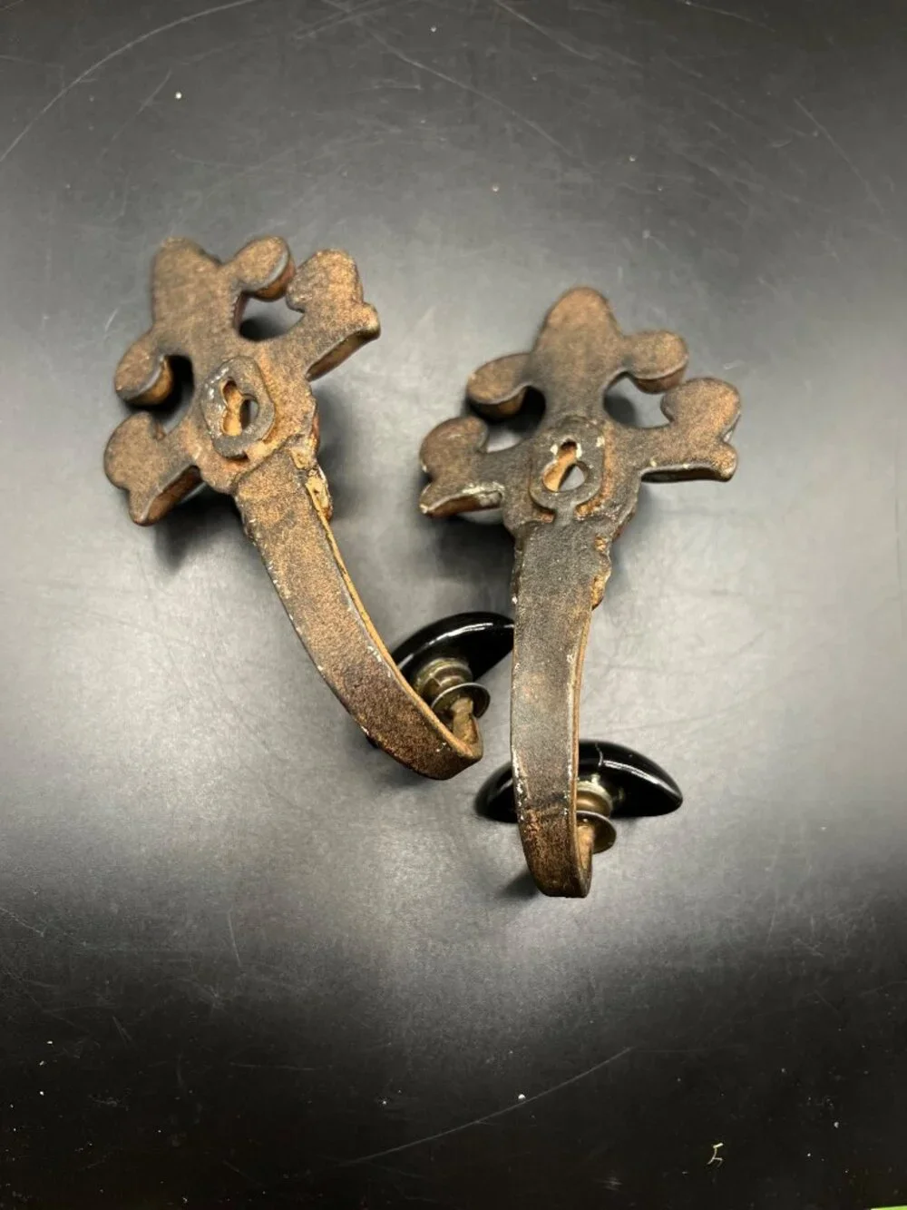 Vintage Pair Cast Iron Fleur-De-Lis Wall Hooks Black Ceramic Knobs Patina Gothic